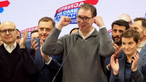 Serbian President Aleksandar Vucic gestures on stage at Serbian Progressive Party (SNS) headquarters following exit polls results of the parliamentary election in Belgrade, Serbia,