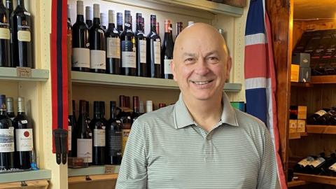 Gerard Richardson inside his wine shop