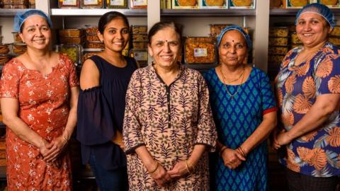 Vijaya Popat (centre) and some of her team