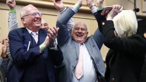 Senator Michael McDowell (left) with No campaigners celebrate at Dublin Castle as the result is announced in the first of the twin referenda to change the Constitution on family and care. Ireland has voted to reject the Government's proposal to change the constitution on family, with 67% of people voting against the amendment