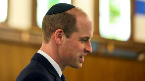 The Prince of Wales wears a kippah as he visits the Western Marble Arch Synagogue in London on 29 February 2024