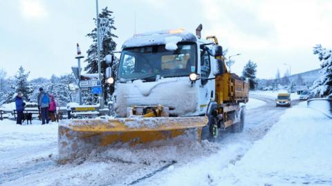 Snow plough clearing the roads in Carrbridge, Scotland in January 2023