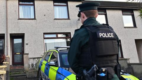 Police outside house in Larne