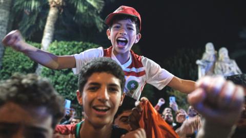 Morocco fans in Spain celebrate their teams win over Spain