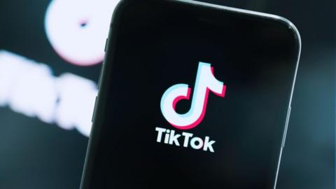 TikTok logo on a phone