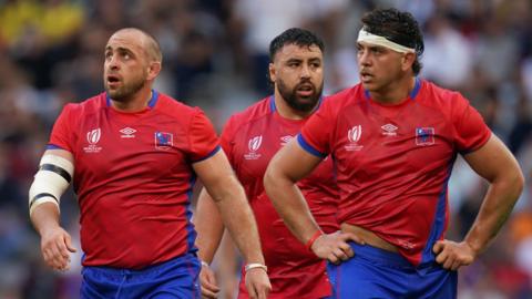 Chile's Ignacio Silva (centre) and team-mates appear dejected during the Rugby World Cup Pool D match