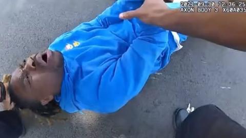 Police bodycam footage showing officers dragging the man from his car