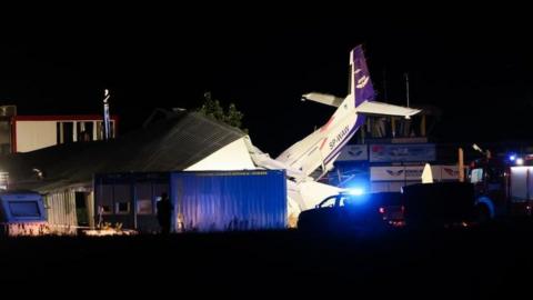 A general night view showing the site of a plane crash in Chrcynno north of Warsaw, Poland, 17 July 2023.