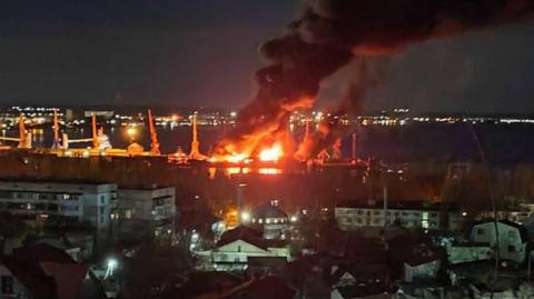 Unverified image posted by the Ukrainian MOD that shows an explosion at the port of Feodosiya, in Russian-occupied Crimea.