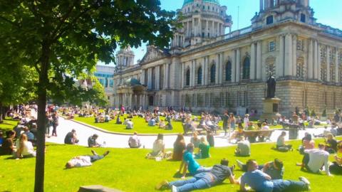 People in sun at City Hall