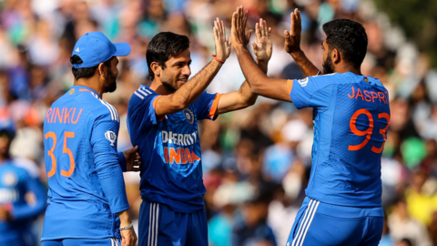 Ravi Bishnoi celebrates a wicket with Mukesh Kumar and Jasprit Bumrah