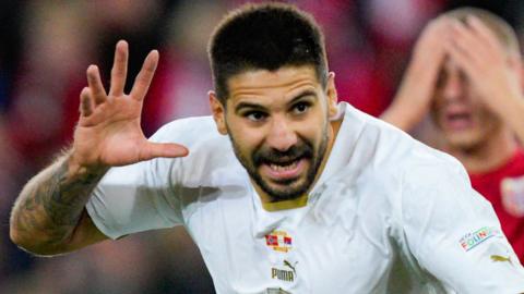 Serbia forward Aleksandar Mitrovic (C) celebrates after scoring in the Nations League against Norway