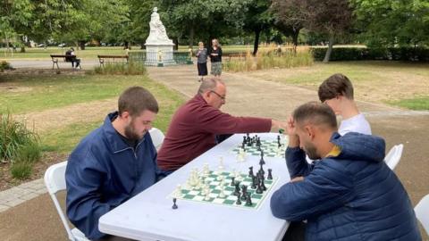 People in Hull playing chess in Pearson Park