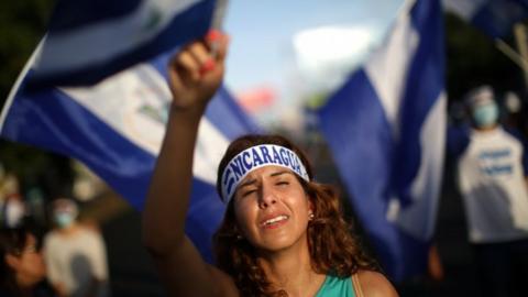 A demonstrator cries as she sings a song during a protest in Managua, Nicaragua, June 18, 2018.