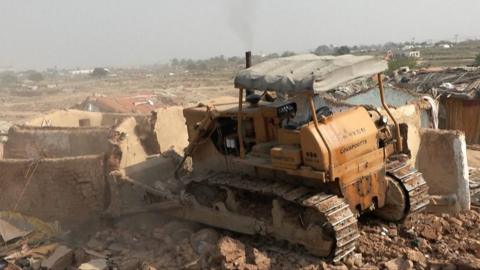 Bulldozer knocks down walls of Afghan houses in Islamabad