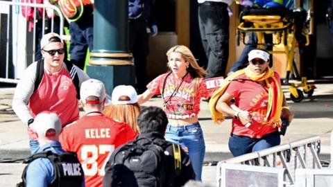 Fans react outside of Union Station after shots were fired after the celebration the celebration of the Kansas City Chiefs winning Super Bowl LVIII.