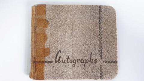 The front cover of the autograph book