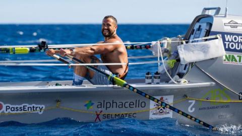 Elliot Awin rowing during the challenge