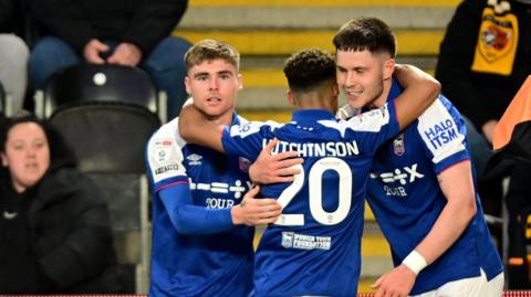 Ipswich players celebrate George Hirst's goal at Hull