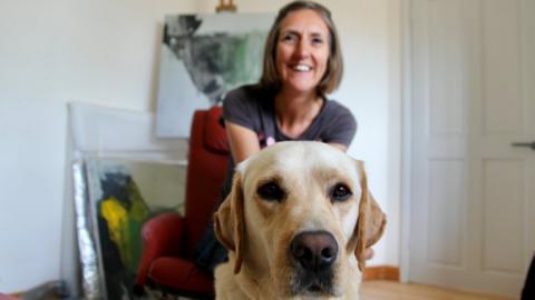 Angela Charles with her guide dog Flynn