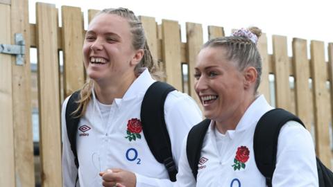 Zoe Aldcroft and Natasha Hunt walking in before an England match