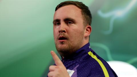 Luke Littler celebrates at the World Darts Championship