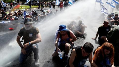 Demonstrators sprayed with water cannon in Jerusalem