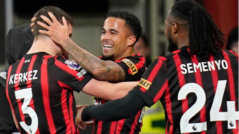 Bournemouth's players celebrate scoring against Crystal Palace in the Premier League