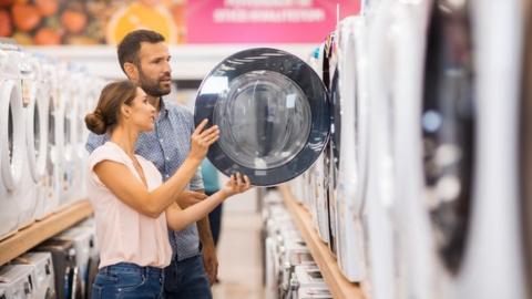 Customers in electrical goods store