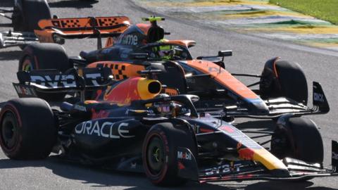 Max Verstappen passes Lando Norris at the start of the Sao Paulo Grand Prix