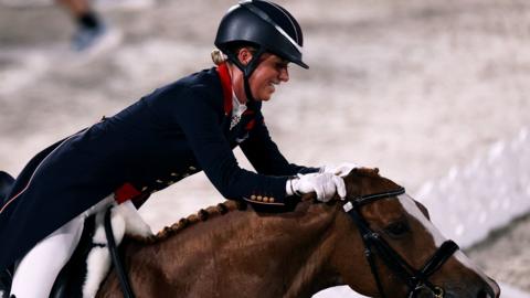 Charlotte Dujardin celebrates with her horse