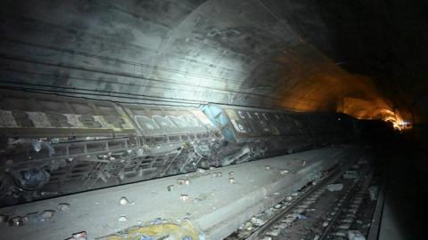 Derailed wagons inside Swiss rail tunnel