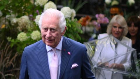 The King and Queen visit a flower market