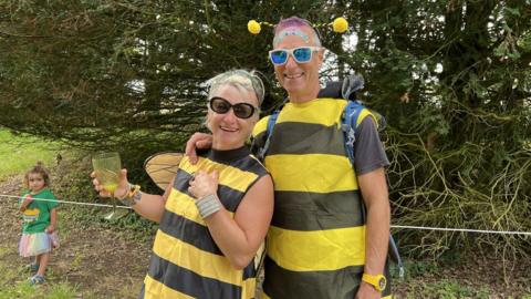 Couple dressed up in bee costumes at the festival