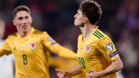 Daniel James (R) and Harry Wilson celebrate in Prague