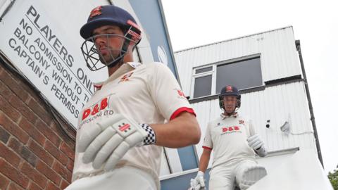 Sir Alastair Cook walks out to bat for Essex