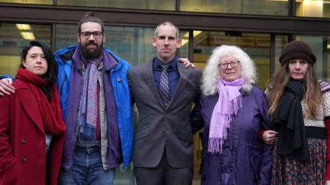 Former Team GB athlete Etienne Stott (centre) and his co-accused Amy Rugg-Easey, 32, Nichola Andersen, 50, Erika Curren, 65, and Shaun Davies, 32