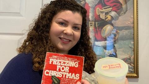 Tahnee Beck with Freezing for Christmas book and a tub of brandy butter from her freezer