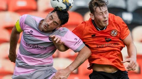 Partick Thistle's Brian Graham and Dundee United's Ollie Denham