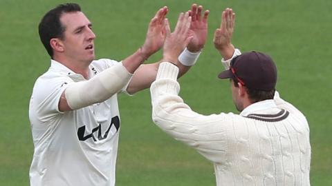 Surrey's Dan Worrall takes a wicket
