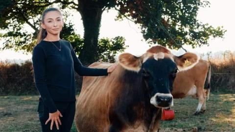 Zoe Marshall with one of her cows