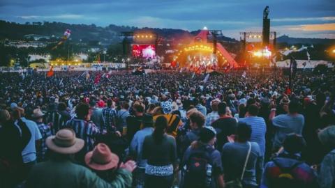 Crowds in front of Glastonbury's Pyramid stage in the evening