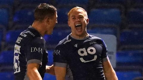 Sale Sharks' Arron Reed (right) celebrates scoring his side's second try against Gloucester