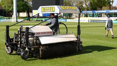 Groundstaff mop up at Grace Road