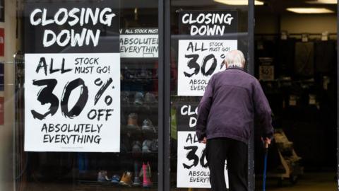 Closing down signs at a shop in Huddersfield, West Yorkshire