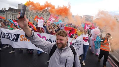 Members of the National Education Union (NEU) take part in a rally through Westminster to Parliament Square, London, in July this year