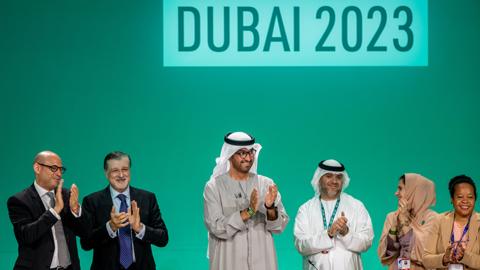 Members clap at COP28