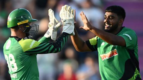 Southern Brave players Devon Conway (left) and Rehan Ahmed (right) celebrate a wicket