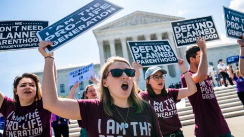 Opponents of abortion gather outside the Supreme Court as the judges weigh their final decisions of the year in Washington, DC, USA 25 June 2018