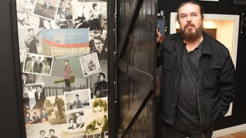 The museum's owner Roag Best with the back door from the former home in Upton Green in Speke